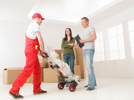 Organised moving boxes and packing materials ready for relocation in Barnes