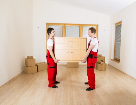 Packed boxes and furniture ready for Barnes removals